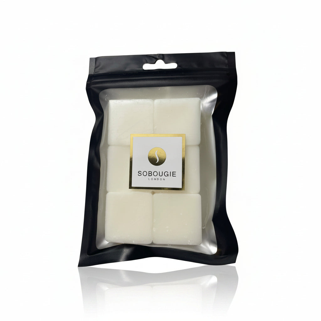 SOBOUGIE Ambre Noble limited edition luxury wax melts in a black matte Mylar pouch showing six individual wax blocks, designed for a pristine melt and sophisticated, balanced hot throw with notes of rich myrrh, tonka, and smooth almond.