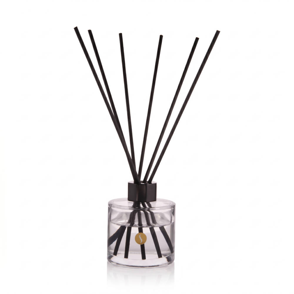 SOBOUGIE Monsieur Bougie 100ml luxury scented reed diffuser in a clear glass bottle with a gold logo and fanned black reeds, engineered for long-lasting room fragrance with notes of fine leather, amber, and patchouli.